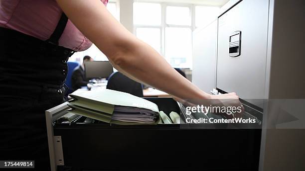 Someone Filing Paper Woman Filing Paperwork Photos and Premium High Res Pictures - Getty Images