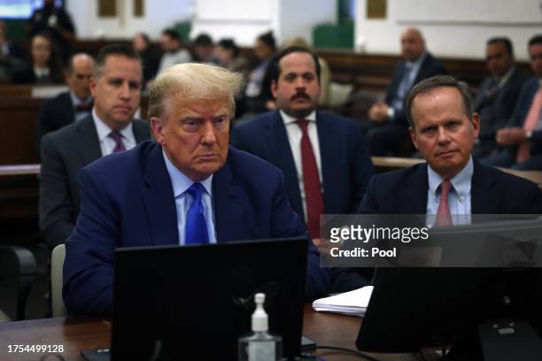 Former President Donald Trump sits in court with his attorney Christopher Kise during his civil fraud trial at New York State Supreme Court on...
