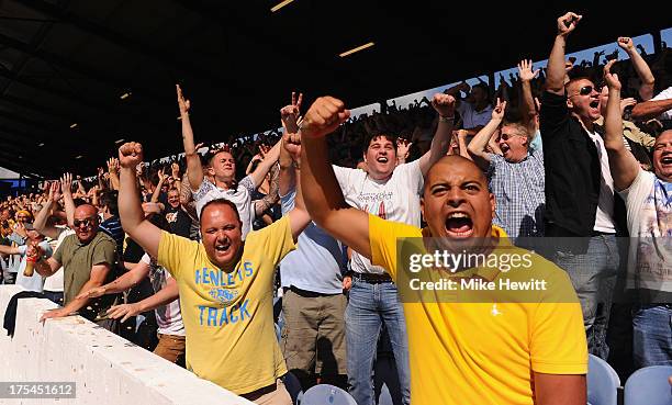 Oxford fans celebrate their team's fourth goal during the Sky Bet League Two match between Portsmouth and Oxford United at Fratton Park on August 03,...