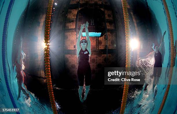 Katie Ledecky of the USA sets a new World Record time of 8:13.86 alongside Lotte Friis of Denmark and Lauren Boyle of New Zealand in the Swimming...