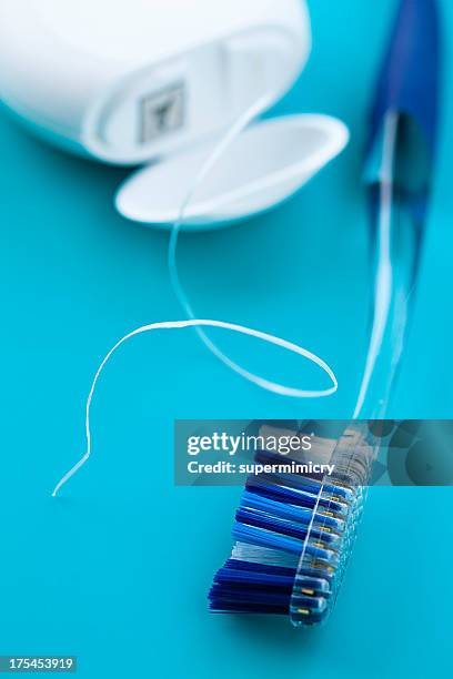 toothbrush and dental floss - dental floss stock pictures, royalty-free photos & images