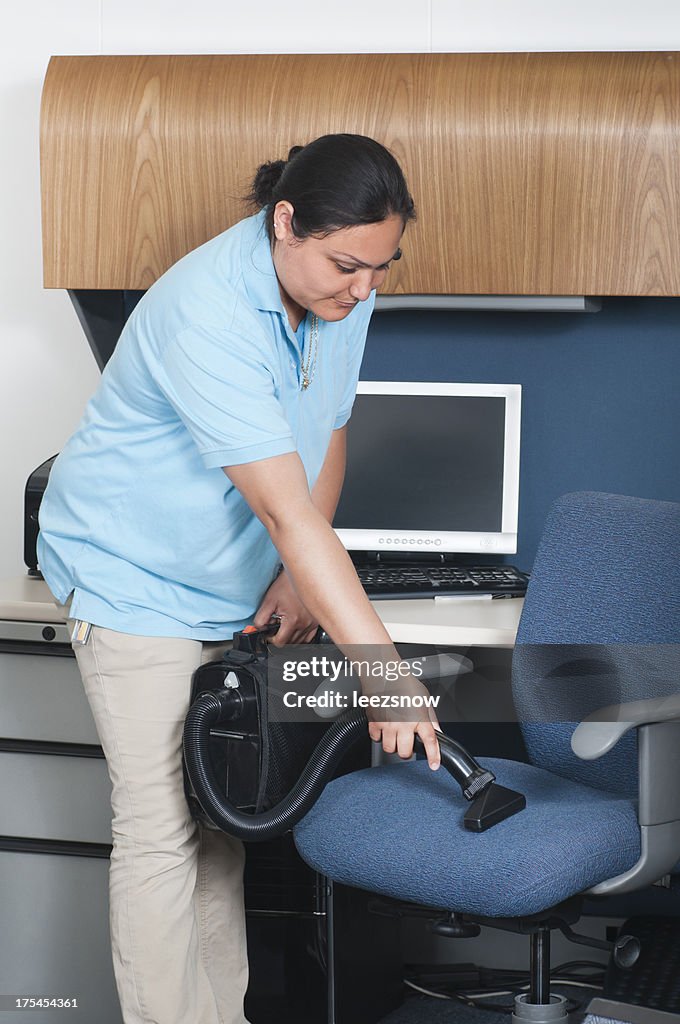 Woman Cleaning an Office