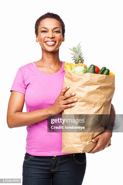 afro-americana donna tiene il sacchetto di generi alimentari sana isolata - carrying groceries foto e immagini stock