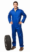 Car Mechanic And Spare Tyre - Isolated