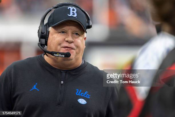 Head coach Chip Kelly of the UCLA Bruins walks on the field against the Oregon State Beavers during the first half at Reser Stadium on October 14,...