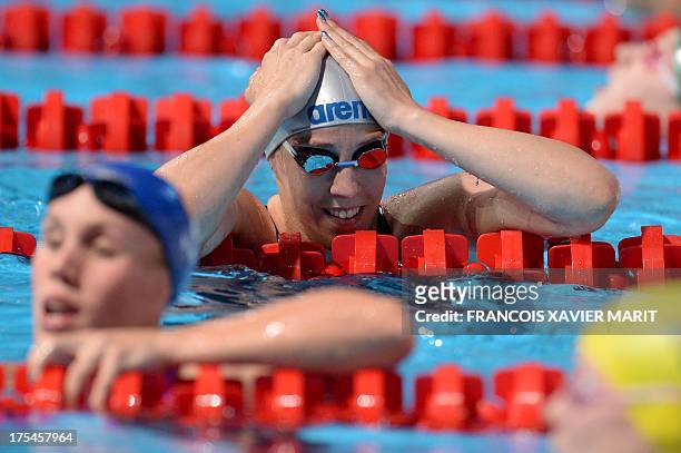 Netherlands' Moniek Nijhuis reacts after competing in the semi-finals of the women's 50-metre freestyle swimming event in the FINA World...