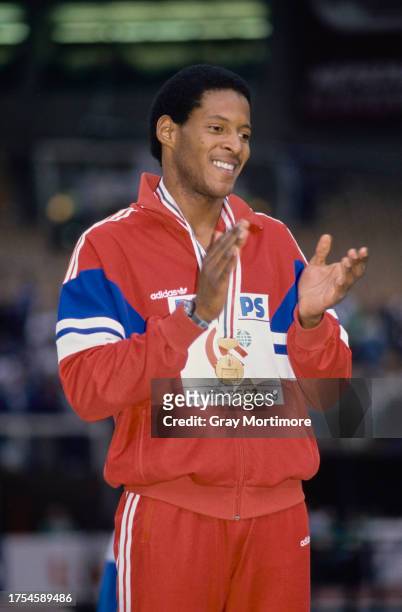 Javier Sotomayor of Cuba on the winners' podium after taking the gold medal in the High Jump at the 1989 IAAF World Indoor Championships in Budapest,...