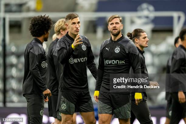 Nico Schlotterbeck and Niclas Fuellkrug of Borussia Dortmund at training ahead of their UEFA Champions League group match against Newcastle United at...