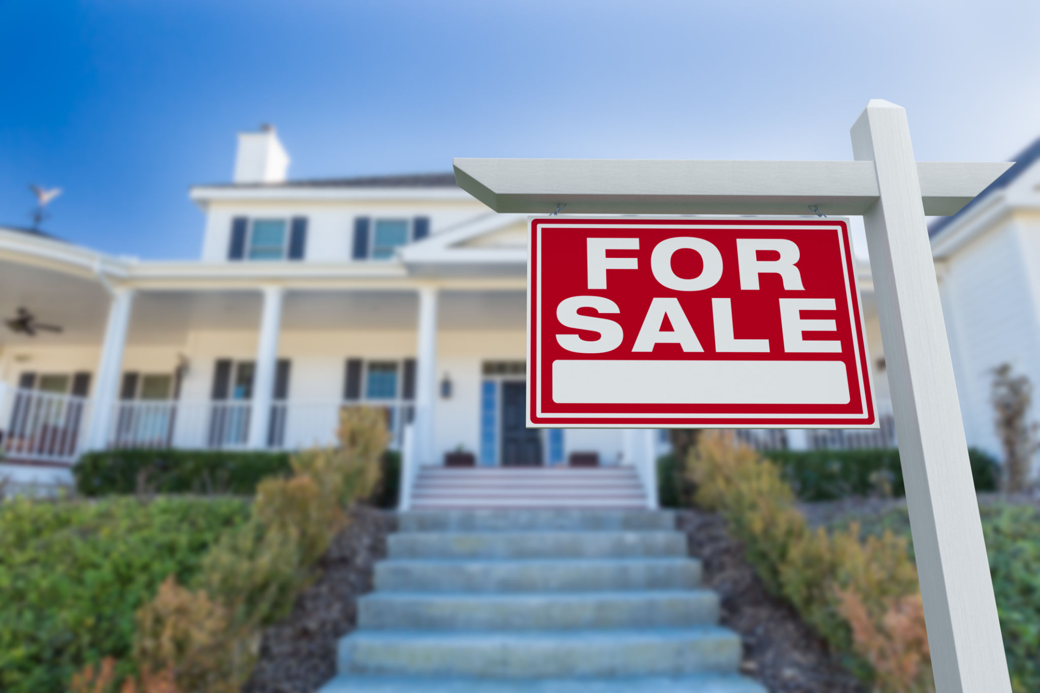 For Sale Real Estate Sign in Front of New House. For Sale Real Estate Sign in Front of New House.