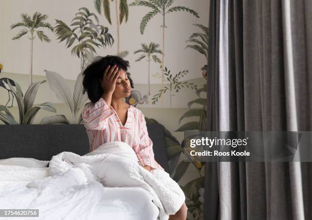 young woman in bed - awake stock pictures, royalty-free photos & images