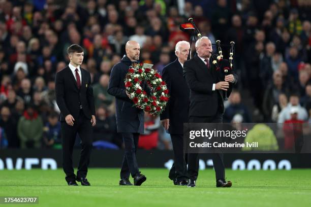 Erik ten Hag, Manager of Manchester United, lays a wreath in tribute to former player Sir Bobby Charlton prior to the UEFA Champions League match...