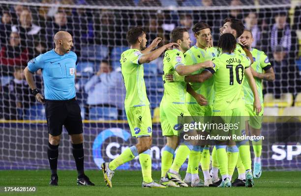 Joseph Rankin-Costello of Blackburn Rovers celebrates with teammates after scoring the team's first goal during the Sky Bet Championship match...