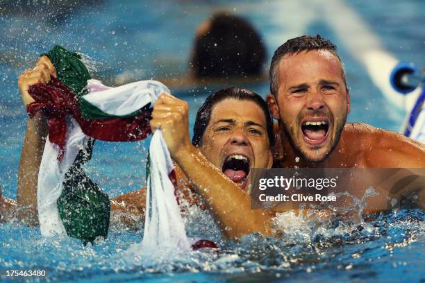 Miklos Gor-Nagy and Marton Szivos of Hungary celebrate after victory in the Water Polo Men's Gold Medal Match between Hungary and Montenegro on day...