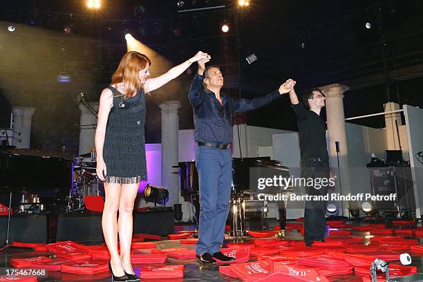 Pianist Aurore Crevelier , Musician Dominique Spagnolo and Singer Julien Clerc during the traditional throw of cushions by the public happy with the...