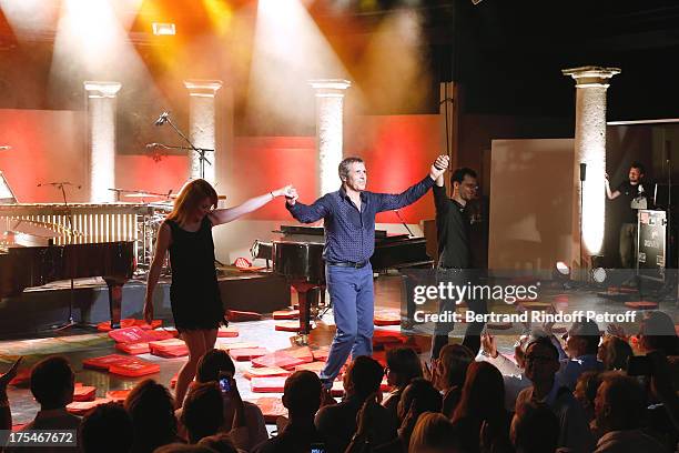 Pianist Aurore Crevelier , Musician Dominique Spagnolo and Singer Julien Clerc during the traditional throw of cushions by the public happy with the...