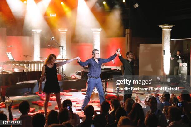 Pianist Aurore Crevelier , Musician Dominique Spagnolo and Singer Julien Clerc during the traditional throw of cushions by the public happy with the...