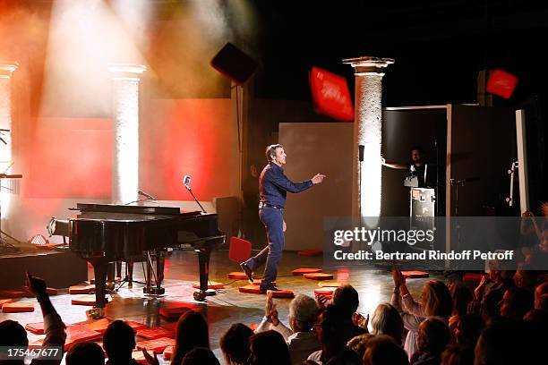 Julien Clerc during the traditional throw of cushions by the public happy with the evening at the final greetin of his "Pianistic" Concert at 29th...