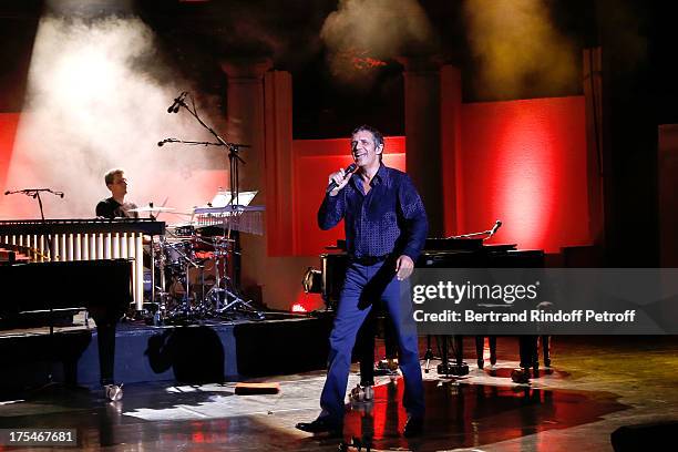 Musician Dominique Spagnolo and Singer Julien Clerc performs in his "Pianistic" Concert at 29th Ramatuelle Festival : Day 4 on August 3, 2013 in...