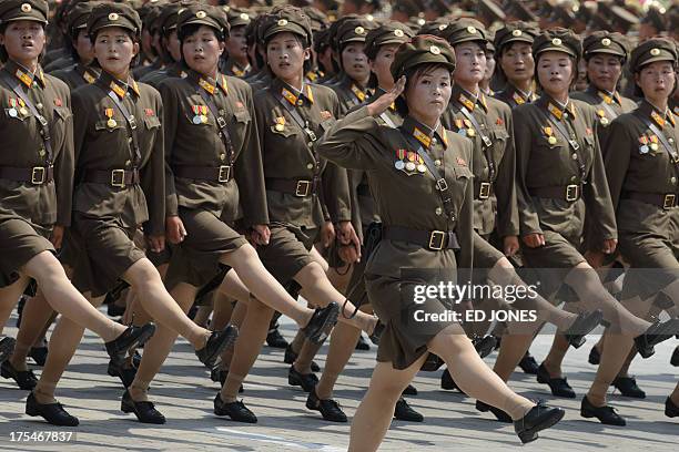 In a photo taken on July 27, 2013 female North Korean soldiers march through Kim Il-Sung square during a military parade marking the 60th anniversary...