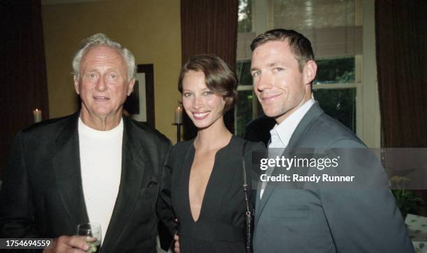 American film producer Samuel Goldwyn Jr and married couple, fashion model Christy Turlington and film director Edward Burns, attend a party...