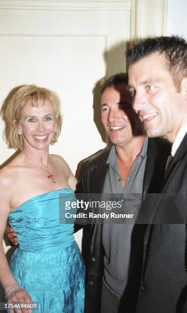 English actress Trudie Styler, American Rock musician Bruce Springsteen, and English actor Clive Owen attend a party following a screening of...
