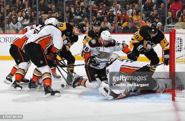 John Gibson of the Anaheim Ducks makes a save on a shot by Reilly Smith of the Pittsburgh Penguins at PPG PAINTS Arena on October 30, 2023 in...