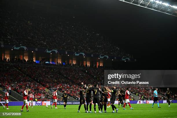 Jude Bellingham of Real Madrid celebrates with teammates after scoring the team's second goal during the UEFA Champions League match between SC Braga...