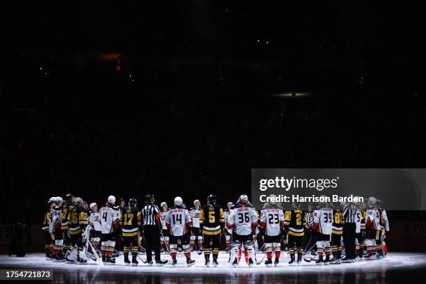 Pittsburgh Penguins and Anaheim Ducks players stand for a moment of silence following the death of former Penguins player Adam Johnson, prior to...