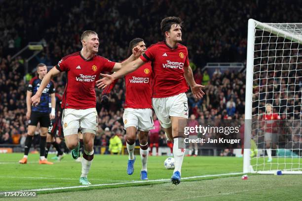 Harry Maguire of Manchester United celebrates after scoring the team's first goal during the UEFA Champions League match between Manchester United...