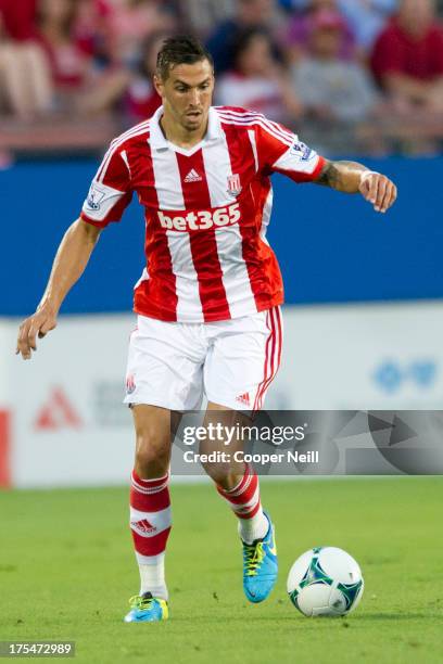 Geoff Cameron of Stoke City brings the ball up field against FC Dallas on July 27, 2013 at FC Dallas Stadium in Frisco, Texas.