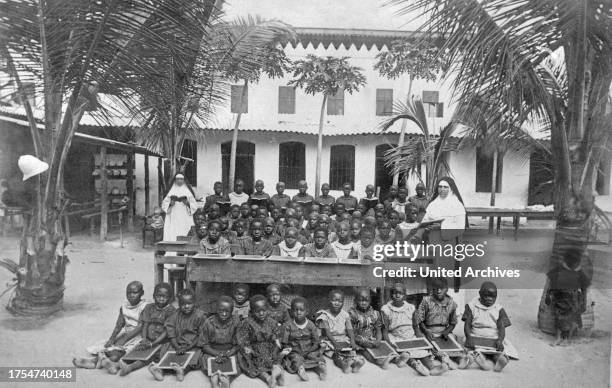 Class of African school children, taught by nuns, German East Africa 1900s.