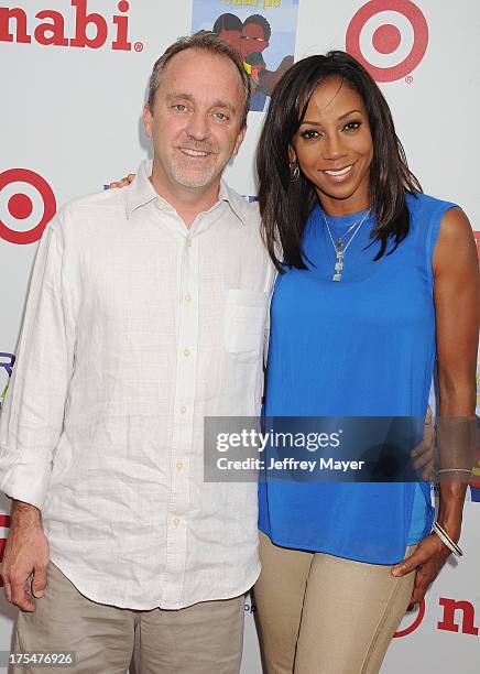 Of Fuhu, Inc. Jim Mitchell and actress Holly Robinson Peete arrive at HollyRod Foundation's 4th Annual 'My Brother Charlie' Carnival at Culver...