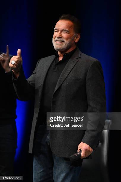 Arnold Schwarzenegger arrives onstage at an Evening with Arnold Schwarzenegger presented by Fane at London Palladium on October 24, 2023 in London,...