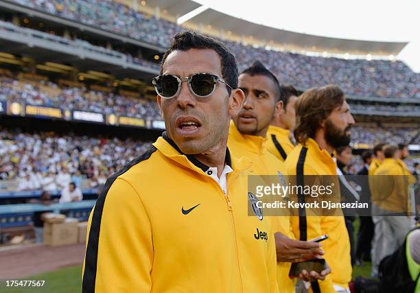 Carlos Tevez of Juventus arrives for the match against Los Angeles Galaxy during the 2013 Guinness International Champions Cup at Dodger Stadium on...