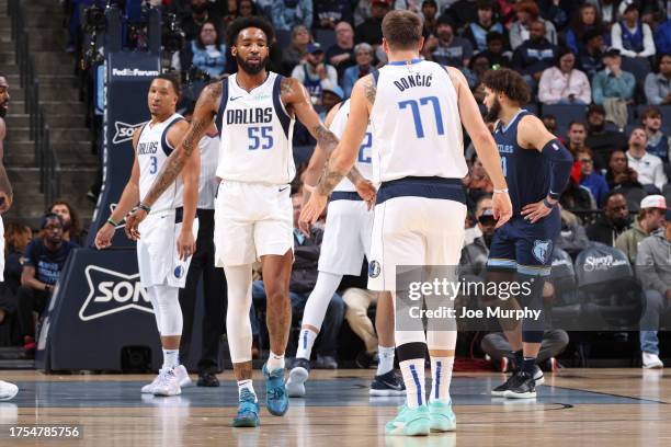 Derrick Jones Jr. #55 and Luka Doncic of the Dallas Mavericks high five during the game against the Memphis Grizzlies on October 30, 2023 at...