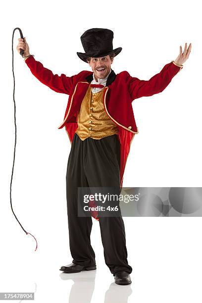 ringmaster perfroming with a whip - dierentemmer stockfoto's en -beelden