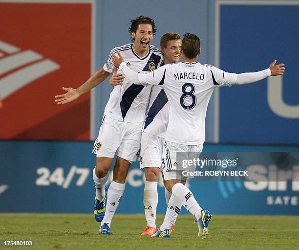 Los Angeles Galaxy's Omar Gonzalez celebrates with teammates after scoring the first goal against Italian football club Juventus at the Guinness...