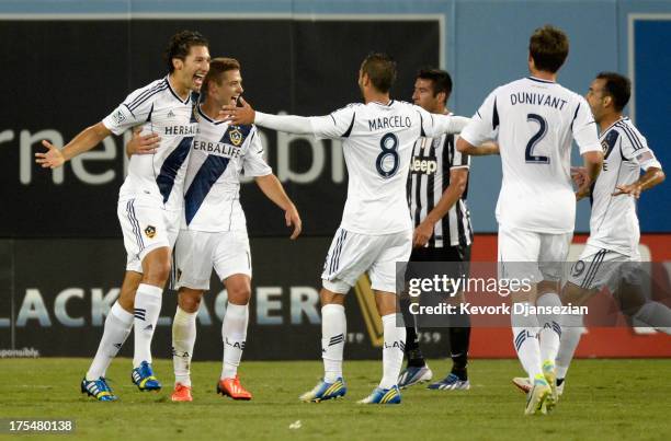 Defender Omar Gonzalez of the Los Angeles Galaxy celebrates his goal against Juventus with teammates during the first half of the 2013 Guinness...