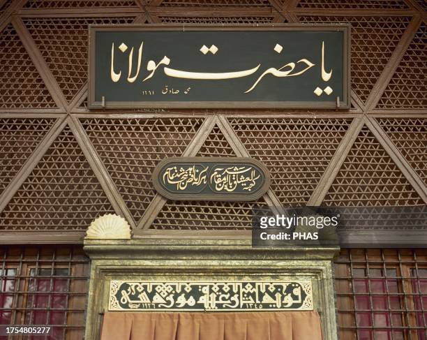 Arabic calligraphy and Kufic script . Entrance to the Monastery of Rumi Mevlana. The taliq inscription above the door was composed by calligrapher...