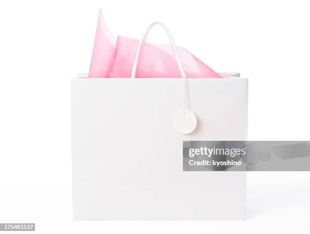 isolated shot of  blank shopping bag with tag on white - cadeautas stockfoto's en -beelden