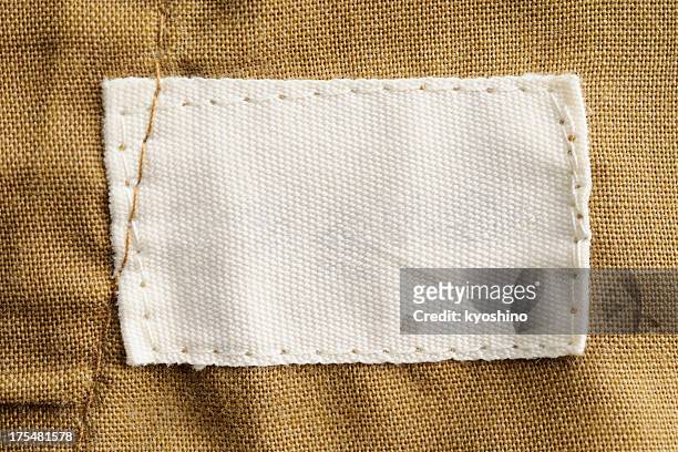 close-up of a blank white clothing label - patch stockfoto's en -beelden