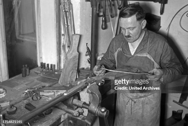 The work of a gunsmith at Karlsbad, 1930s.