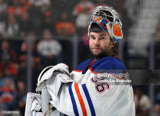 Jack Campbell of the Edmonton Oilers looks on during a timeout against the Philadelphia Flyers at the Wells Fargo Center on October 19, 2023 in...