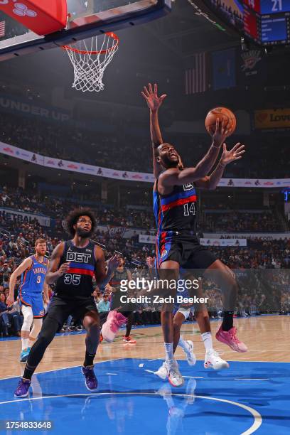 Alec Burks of the Detroit Pistons drives to the basket during the game against the Oklahoma City Thunder on October 30, 2023 at Paycom Arena in...