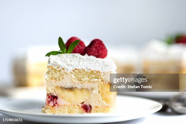 fruit cake with bananas and raspberries - slice of cake stock pictures, royalty-free photos & images