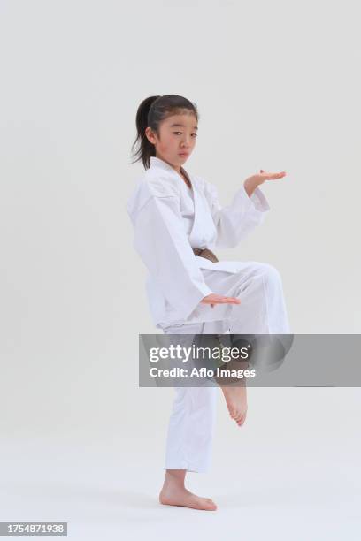 japanese kid in karate uniform on white background - karate girl isolated stock pictures, royalty-free photos & images