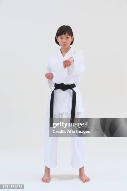 japanese kid in karate uniform on white background - karate girl isolated stock pictures, royalty-free photos & images