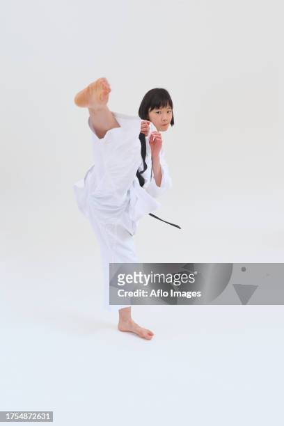 japanese kid in karate uniform on white background - karate girl isolated stock pictures, royalty-free photos & images