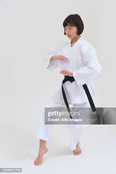 japanese kid in karate uniform on white background - karate girl isolated stock pictures, royalty-free photos & images