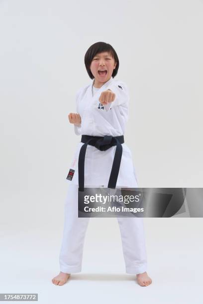 japanese kid in karate uniform on white background - karate girl isolated stock pictures, royalty-free photos & images